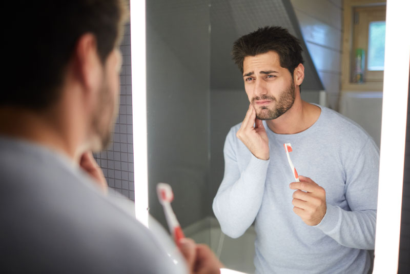 Dental Patient Suffering From Gum Disease Pain